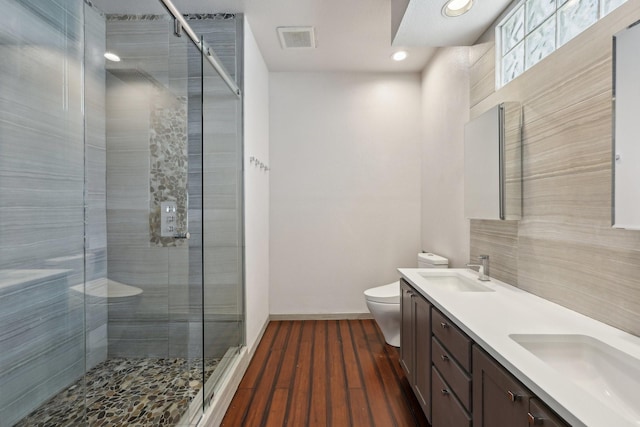 3804 Mattison Ave, Fort Worth, TX 76107 - bathroom featuring double vanity, a shower stall, wood finished floors, and recessed lighting