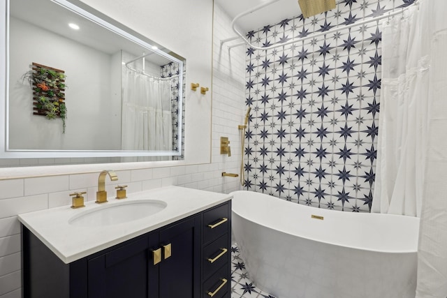3804 Mattison Ave, Fort Worth, TX 76107 - full bathroom with tile walls, vanity, and a soaking tub