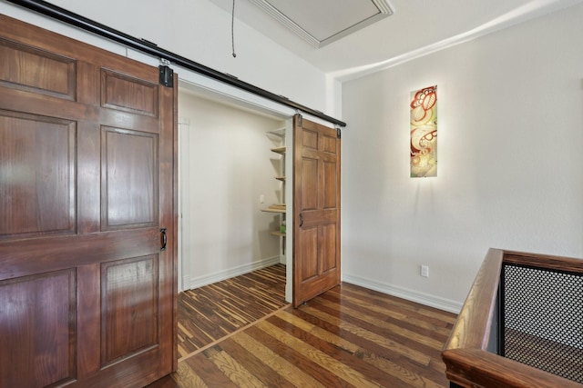 3804 Mattison Ave, Fort Worth, TX 76107 - unfurnished bedroom with dark wood-style flooring and a barn door