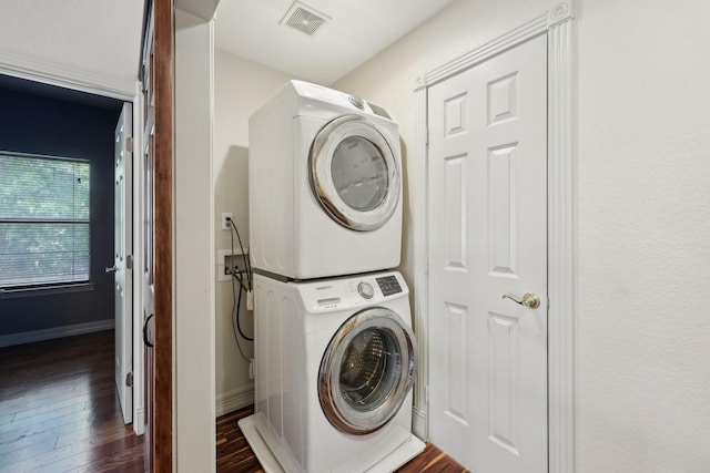 3804 Mattison Ave, Fort Worth, TX 76107 - laundry room with stacked washer / dryer and dark wood finished floors