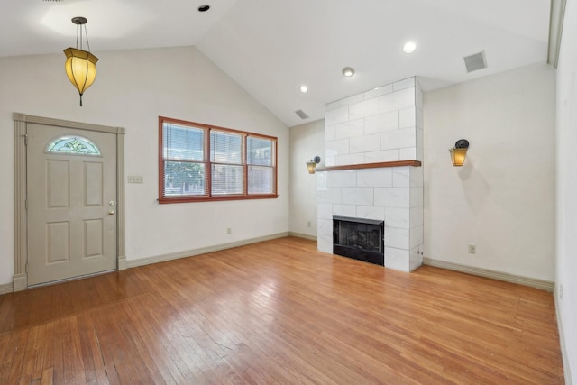 3804 Mattison Ave, Fort Worth, TX 76107 - unfurnished living room with wood-type flooring, a fireplace, recessed lighting, and high vaulted ceiling