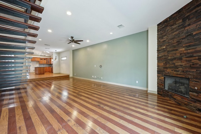 3804 Mattison Ave, Fort Worth, TX 76107 - unfurnished living room featuring light wood finished floors, a fireplace, a ceiling fan, and recessed lighting