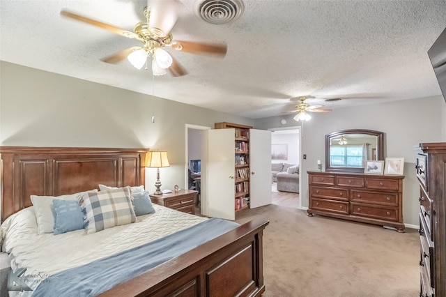 3126 Salinas Dr, Abilene, TX 79605 - bedroom featuring light carpet, a textured ceiling, and ceiling fan