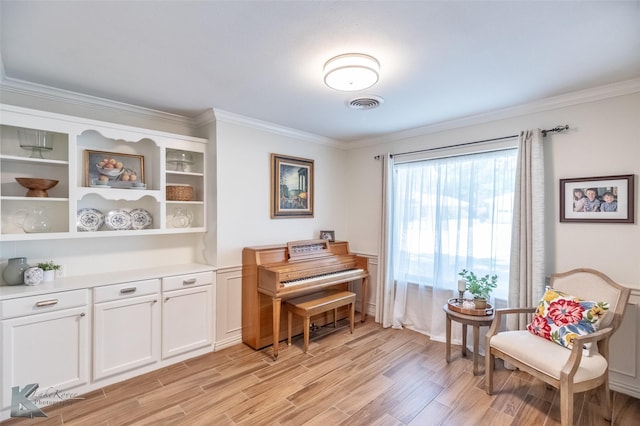 3126 Salinas Dr, Abilene, TX 79605 - sitting room featuring crown molding and light wood-style flooring