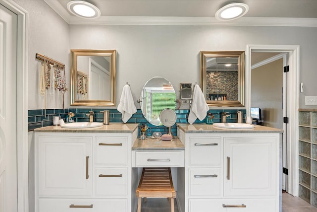 122 County Road 603, Eastland, TX 76448 - bathroom featuring crown molding, double vanity, and backsplash