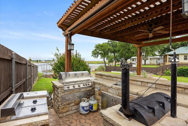 122 County Road 603, Eastland, TX 76448 - fenced backyard with ceiling fan and a patio