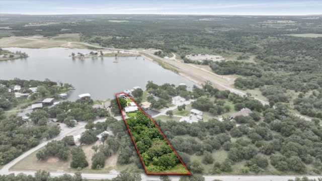 122 County Road 603, Eastland, TX 76448 - aerial overview of property's location with a large body of water, property boundaries highlighted, and a forest