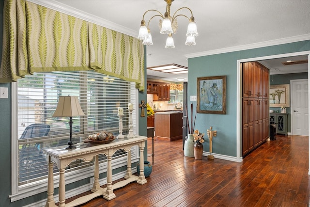 122 County Road 603, Eastland, TX 76448 - corridor featuring ornamental molding, a chandelier, dark wood-style flooring, and baseboards
