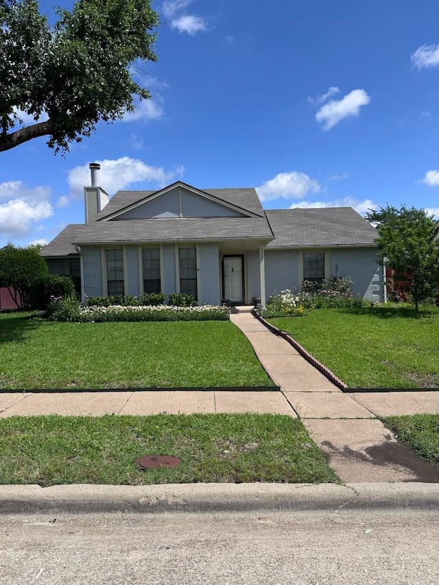 2525 Pear Tree Ln, Garland, TX 75042 - single story home with a front yard and a chimney