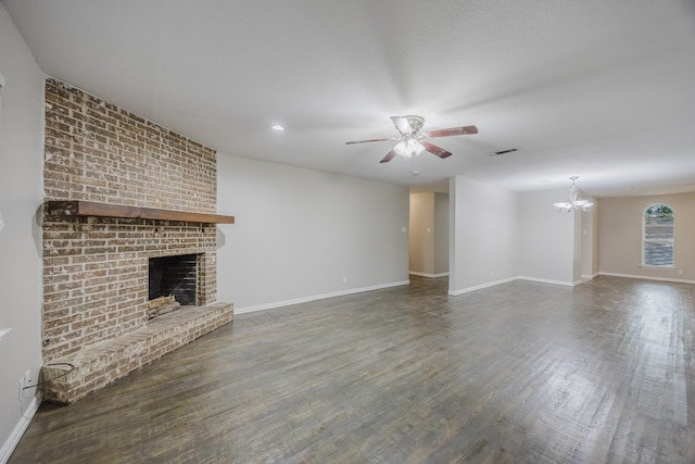 1624 Summer Place Cir, Irving, TX 75062 - unfurnished living room featuring a ceiling fan, a fireplace, baseboards, a chandelier, and wood finished floors
