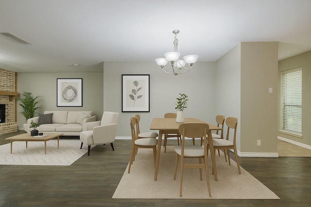 1624 Summer Place Cir, Irving, TX 75062 - dining room featuring wood finished floors, a chandelier, baseboards, and a fireplace