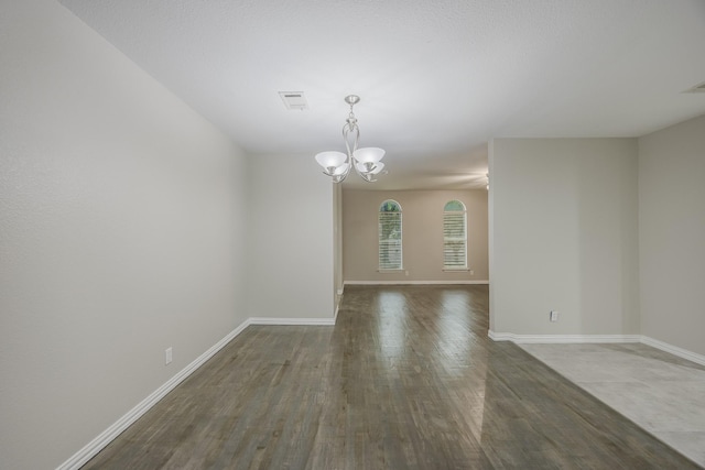 1624 Summer Place Cir, Irving, TX 75062 - spare room with a chandelier, baseboards, and wood finished floors