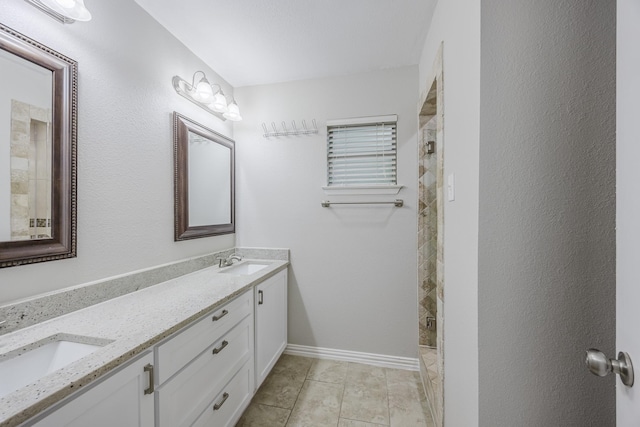 1624 Summer Place Cir, Irving, TX 75062 - bathroom with double vanity, tiled shower, tile patterned flooring, and baseboards