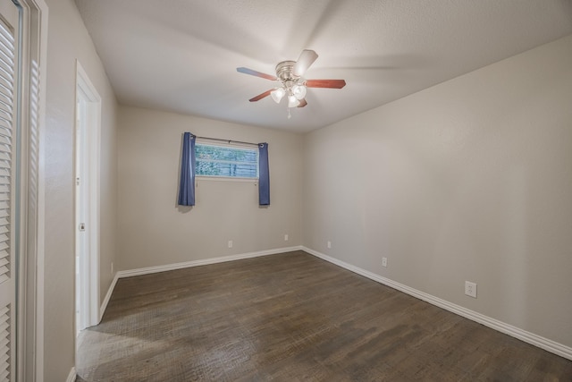 1624 Summer Place Cir, Irving, TX 75062 - unfurnished bedroom with dark wood-type flooring, baseboards, and ceiling fan