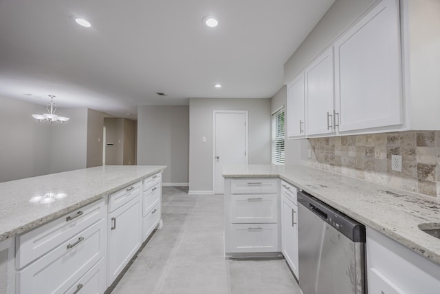1624 Summer Place Cir, Irving, TX 75062 - kitchen with stainless steel dishwasher, white cabinets, decorative backsplash, light stone countertops, and baseboards