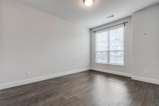 8532 Melrose, The Colony, TX 75056 - unfurnished room featuring baseboards and dark wood-style floors