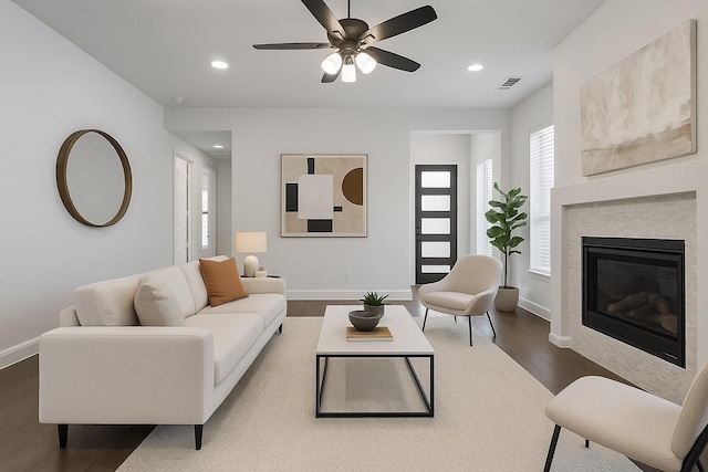 8532 Melrose, The Colony, TX 75056 - living room with dark wood finished floors, baseboards, a ceiling fan, recessed lighting, and a glass covered fireplace