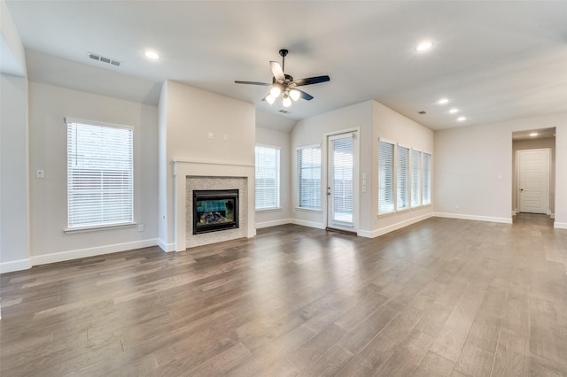 8532 Melrose, The Colony, TX 75056 - unfurnished living room featuring ceiling fan, plenty of natural light, dark wood finished floors, and recessed lighting
