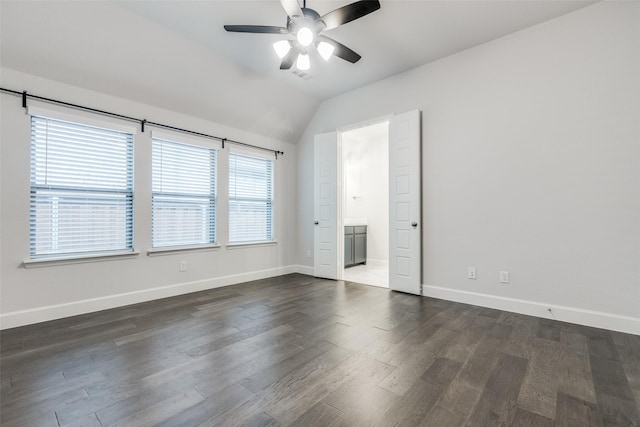 8532 Melrose, The Colony, TX 75056 - spare room featuring ceiling fan, dark wood-style floors, and lofted ceiling