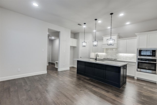 8532 Melrose, The Colony, TX 75056 - kitchen with stainless steel appliances, light countertops, tasteful backsplash, a sink, and white cabinets