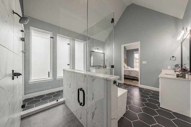 562 Broadleaf Way, Haslet, TX 76052 - ensuite bathroom with vaulted ceiling, vanity, a shower stall, tile patterned flooring, and baseboards