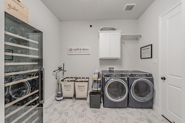 562 Broadleaf Way, Haslet, TX 76052 - washroom with cabinet space, separate washer and dryer, wine cooler, and baseboards