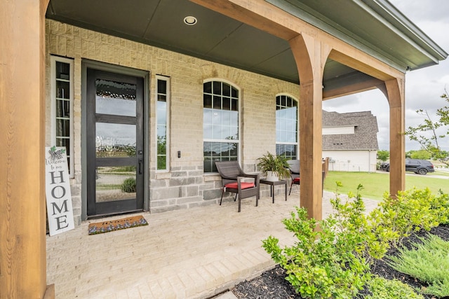 562 Broadleaf Way, Haslet, TX 76052 - entrance to property with a porch and brick siding
