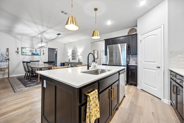 168 Ridgetop Trl, Rhome, TX 76078 - kitchen with a sink, light wood-type flooring, light countertops, and recessed lighting
