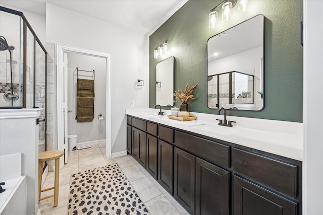 168 Ridgetop Trl, Rhome, TX 76078 - bathroom featuring a shower stall, double vanity, toilet, and tile patterned flooring