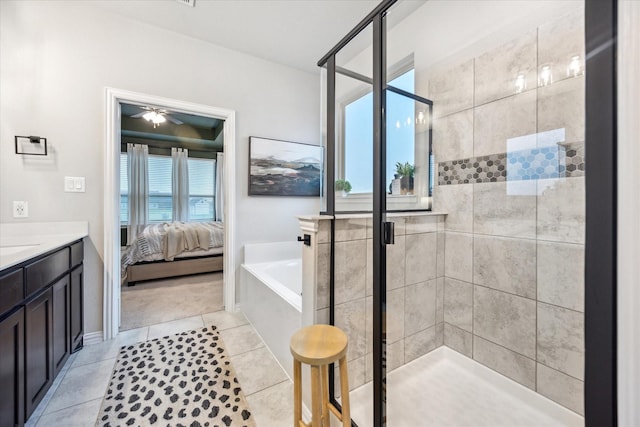 168 Ridgetop Trl, Rhome, TX 76078 - ensuite bathroom with a shower stall, a garden tub, ceiling fan, tile patterned floors, and vanity