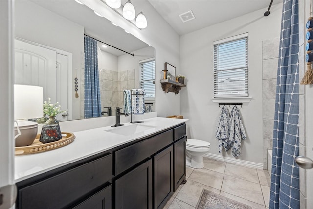 168 Ridgetop Trl, Rhome, TX 76078 - full bathroom featuring plenty of natural light, vanity, toilet, and tile patterned floors