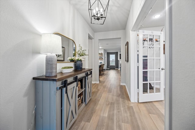 168 Ridgetop Trl, Rhome, TX 76078 - entryway featuring light wood-style floors and a chandelier