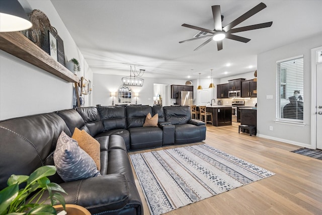 168 Ridgetop Trl, Rhome, TX 76078 - living area with ceiling fan, light wood-style floors, recessed lighting, and baseboards