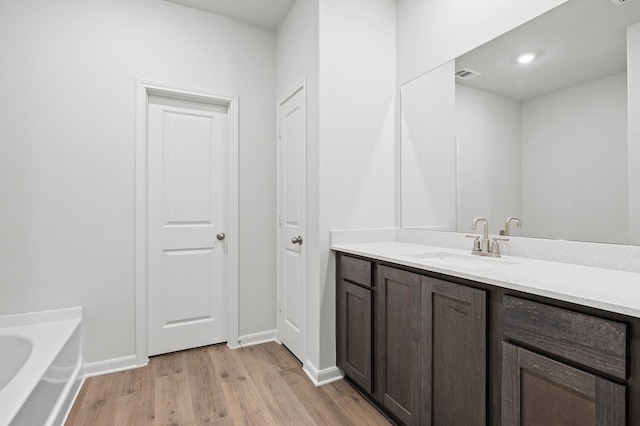426 Gib Woodall Dr, Venus, TX 76084 - full bath with vanity, wood finished floors, a bath, and baseboards