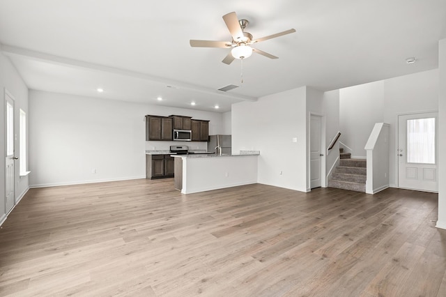 426 Gib Woodall Dr, Venus, TX 76084 - unfurnished living room featuring stairs, recessed lighting, light wood-style flooring, a ceiling fan, and baseboards
