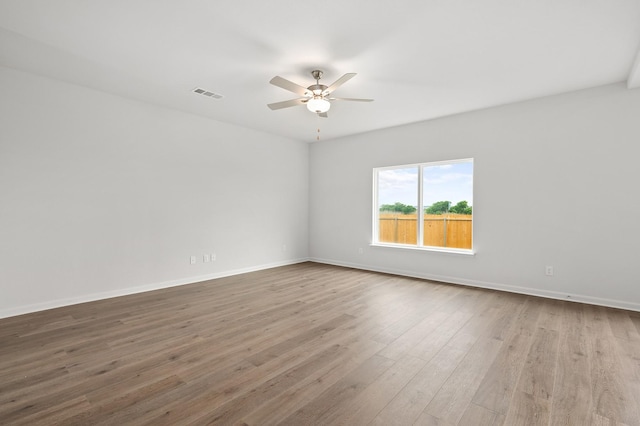 426 Gib Woodall Dr, Venus, TX 76084 - empty room featuring a ceiling fan, wood finished floors, and baseboards