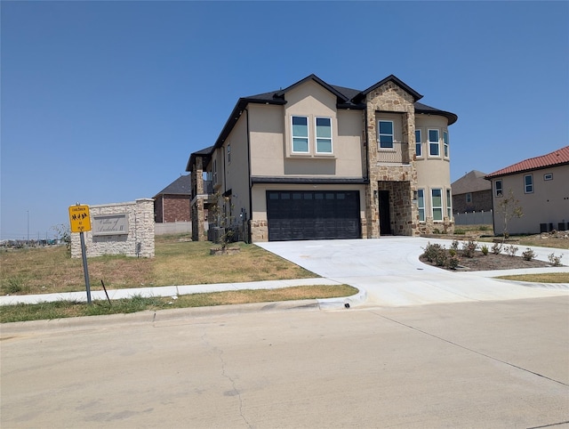 4715 Glavica Dr, Irving, TX 75062 - view of front of property with stone siding, an attached garage, stucco siding, and driveway