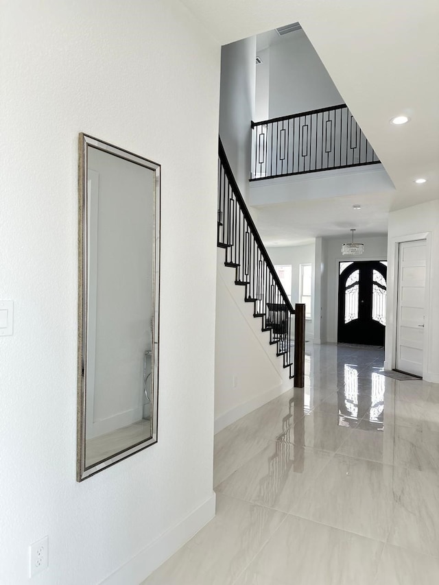4715 Glavica Dr, Irving, TX 75062 - entrance foyer with baseboards, stairs, recessed lighting, and light marble finish floors