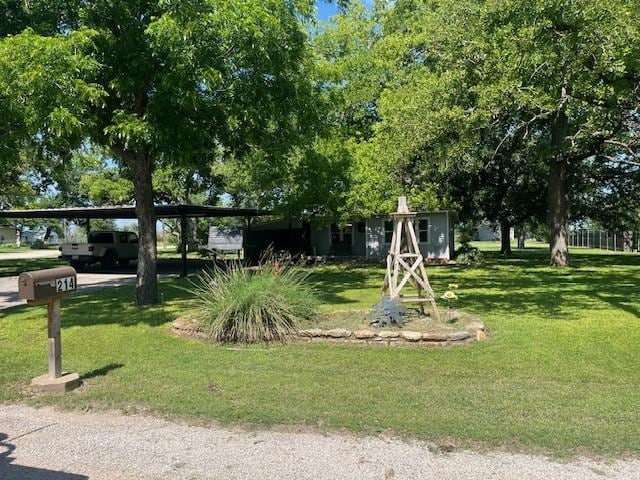 214 Hemphill St, Hico, TX 76457 - view of home's community with a lawn