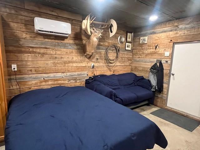 214 Hemphill St, Hico, TX 76457 - bedroom featuring wood walls and a wall mounted AC