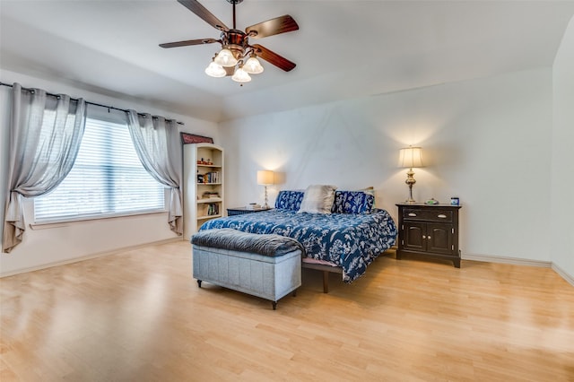 3820 Blossom Dr, Sachse, TX 75048 - bedroom with light wood-type flooring, baseboards, and a ceiling fan