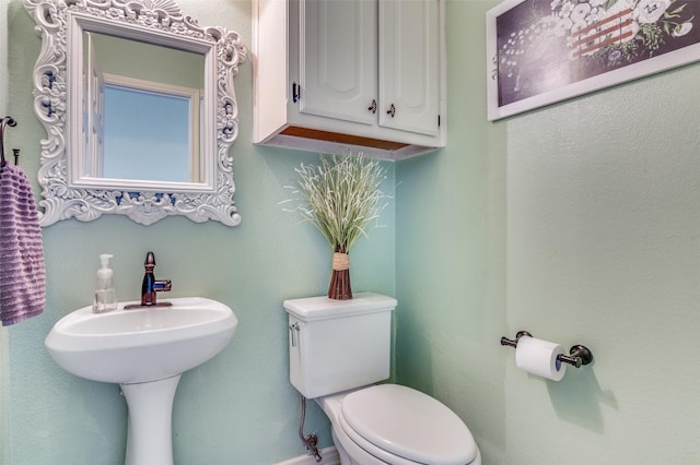 3820 Blossom Dr, Sachse, TX 75048 - half bathroom with toilet and baseboards