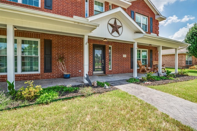 3820 Blossom Dr, Sachse, TX 75048 - entrance to property featuring a porch, brick siding, and a lawn