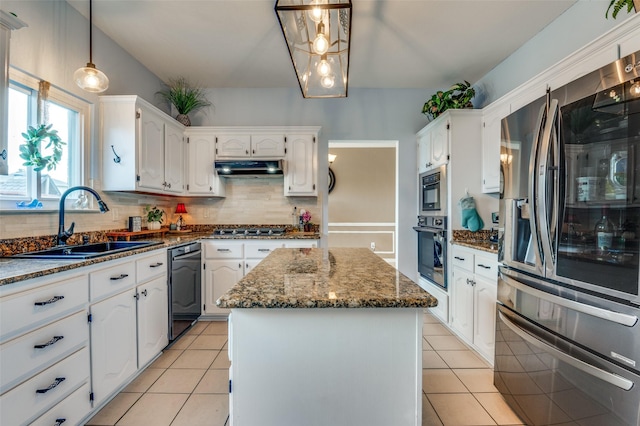 3820 Blossom Dr, Sachse, TX 75048 - kitchen with stainless steel appliances, a sink, a center island, and light tile patterned flooring