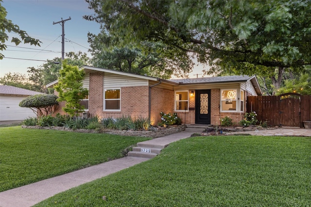 9705 Ash Creek Dr, Dallas, TX 75228 - view of front of property with brick siding and a gate