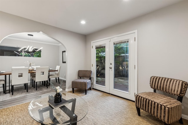 9705 Ash Creek Dr, Dallas, TX 75228 - living area with arched walkways, french doors, a chandelier, and recessed lighting