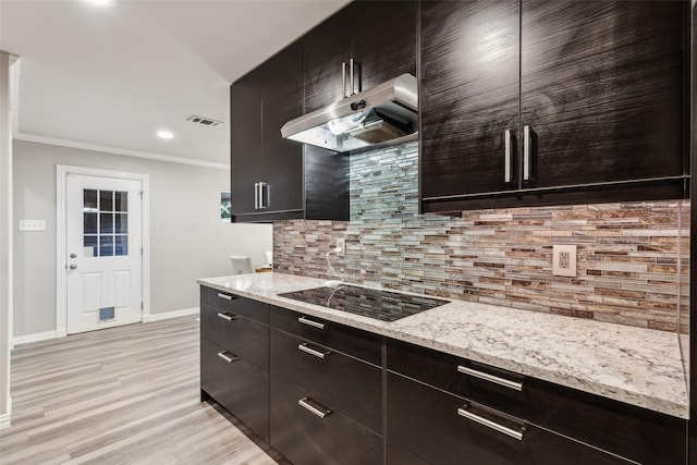 9705 Ash Creek Dr, Dallas, TX 75228 - kitchen with exhaust hood, black electric cooktop, backsplash, baseboards, and light wood-type flooring