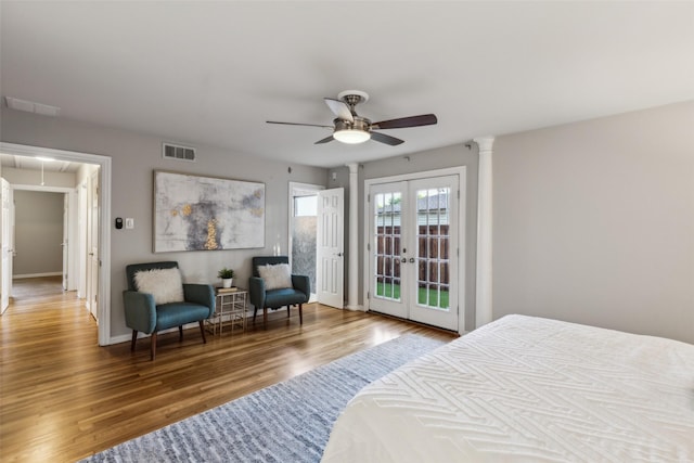 9705 Ash Creek Dr, Dallas, TX 75228 - bedroom featuring attic access, wood finished floors, french doors, baseboards, and ceiling fan