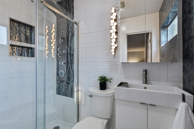 9705 Ash Creek Dr, Dallas, TX 75228 - full bath featuring tile walls, toilet, a shower stall, vanity, and decorative backsplash