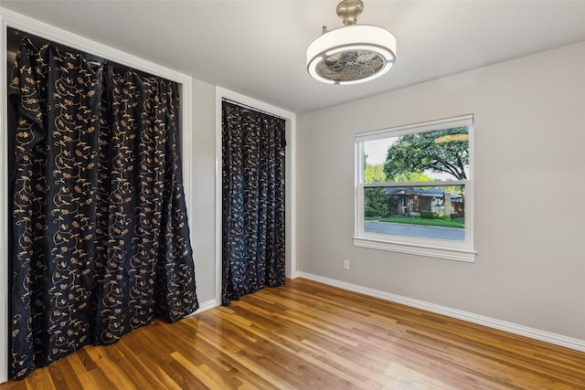 9705 Ash Creek Dr, Dallas, TX 75228 - unfurnished room with wood finished floors and baseboards